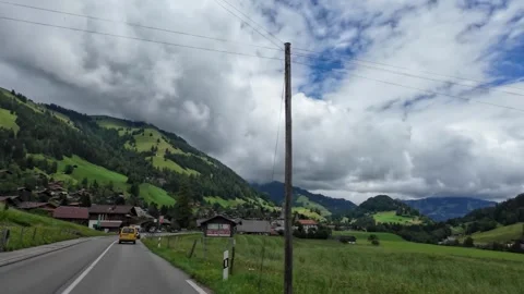 Driving Toward Alpine Village Rooftops on Rural Road 库存影片 341366212