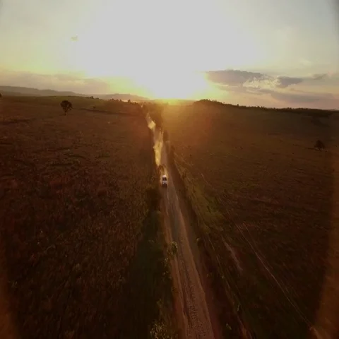 Driving towards camera with sunset in background Vídeos de archivo 69725251