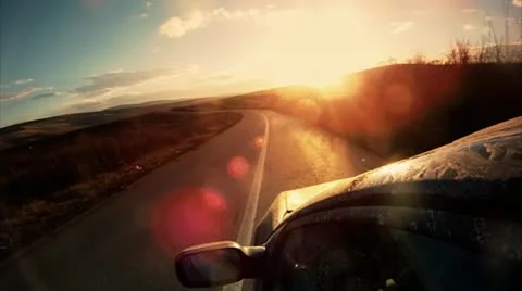 Driving towards the sunset Video stock 14808214