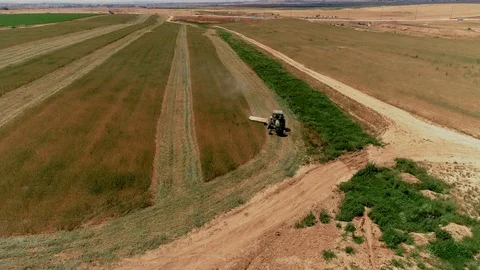 Driving a tractor in a wheat field Stock Footage 107947536