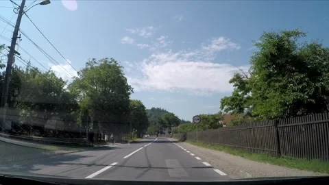 Driving trough the town of Bran in Romania Stock Footage 242501375