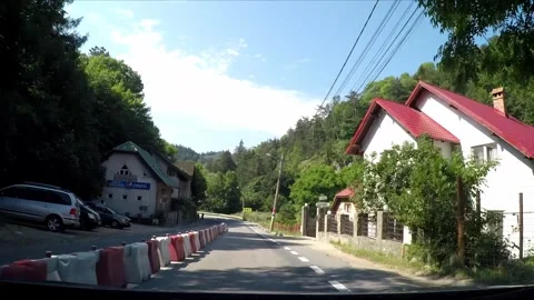 Driving trough the town of Bran in Romania Stock Footage 242501423