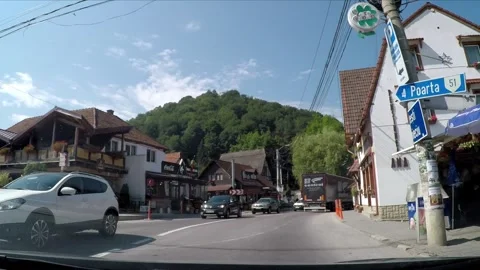 Driving trough the town of Bran in Romania Stock Footage 242501426