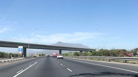Driving under a bridge towards Table Mountain Cape Town Video stock 152623350