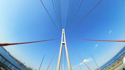 Driving Under Cable-Stayed Bridge on Sunny Day. Car Drives Under a Cable-Stayed Video stock 312860035