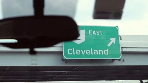 Driving under an East Cleveland highway sign in ohio Stock Footage