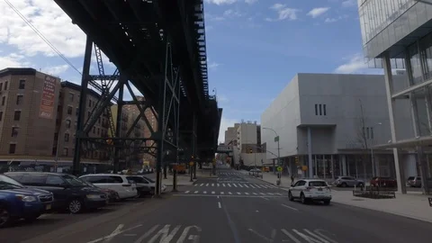 Driving under elevated train onto 125th St. in Harlem NYC Stockbeeldmateriaal 127945151