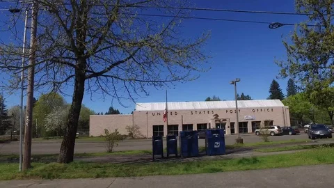 Driving by US Post Office Flag at Half Mast Stock Footage 92450751