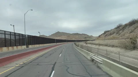 Driving by USA Mexico Border Wall Video stock 162657442