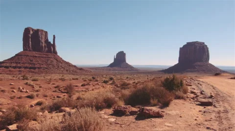Driving USA: Monument Valley. Point of view car shot along rough dirt road Stock Footage 57261990