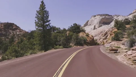 Driving USA: Point of view car shot on road through Zion National Park, Utah Stock Footage 77447456