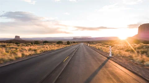 Driving USA: Spectacular sunset driving along lonely road in American desert Stock Footage