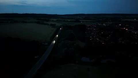 Driving vehicles on dark suburb interstate road of United States. Lighting Stock Footage 310920777