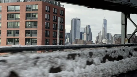 Driving view entering Williamsburg Bridge with Freedom Tower skyline snow NYC 스톡 동영상 148005663