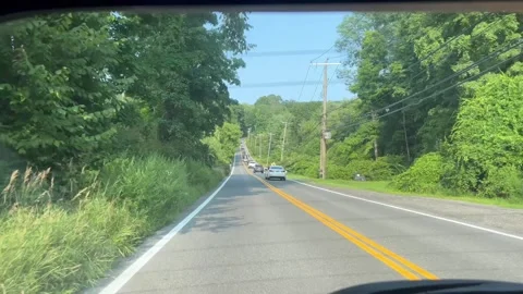Driving View From Rear Window Looking Back at Cars on Rural Road Stock Footage 342082484