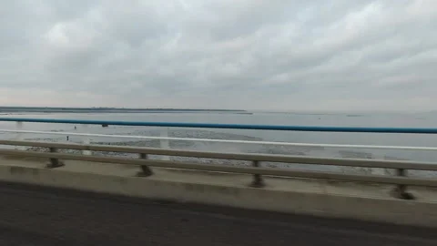 Driving View of Tagus River from Vasco da Gama Bridge in Lisbon Stock Footage 310307619
