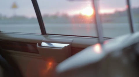 Driving a vintage car in the sunset. View through the window. Vídeo Stock 68028341