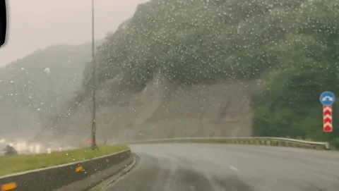 Driving on Wet Highway Through Mountain Pass in Rain Stock Footage 340868958