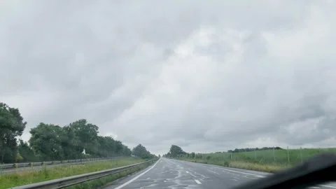 Driving on a Wet Highway Under Cloudy Skies in Paris France Stock Footage 335361954