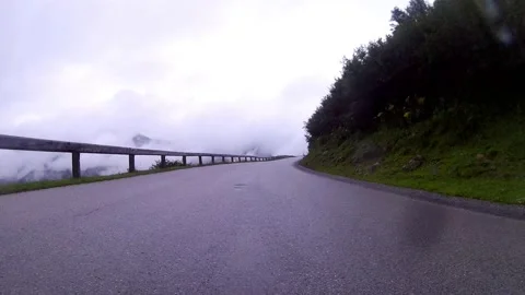 Driving on a wet mountain road on the austrian sölkpass Stock Footage 137494868