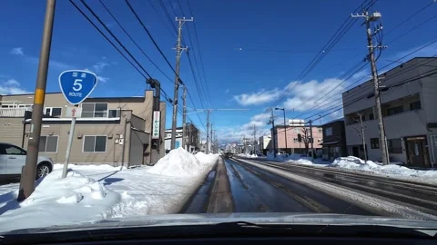Driving on wet winter road through Hakodate city main street Video stock 333069404