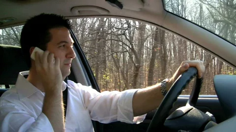 Driving While Talking on Cell Phone Video stock 641608