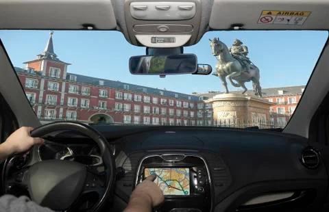 Driving while using navigation system in Plaza Mayor, Madrid, Spain Stock Photos