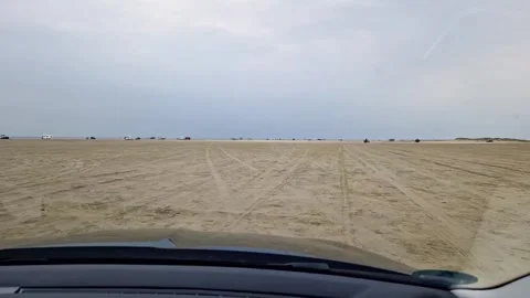 Driving on Wide Sandy Beach of Rm Island near Ribe, Denmark Video stock 333897404