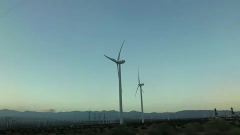 Driving by Wind Turbines Stock Footage