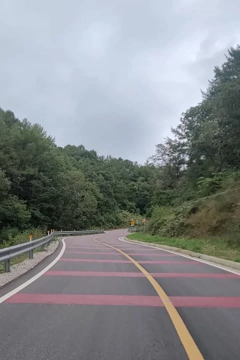 Driving on a Winding Mountain Pass at 3x Speed from Driver's View Video stock 323703186