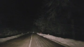 Driving on the winter road at night through the mountain Stock-Footage 86127891
