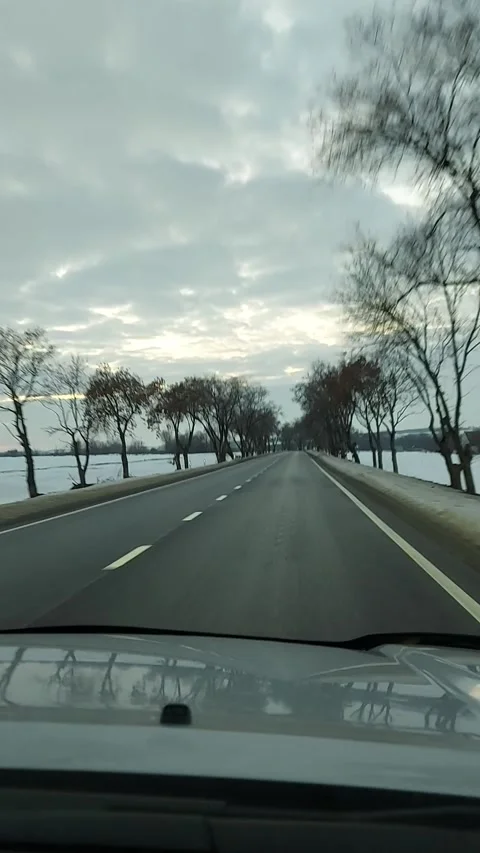 Driving winter snow road. View through the windshield on the highway in winter Stock Footage 318965319