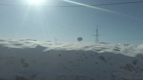 Driving in winter snowy mountains, view from car Stock Footage 103732010