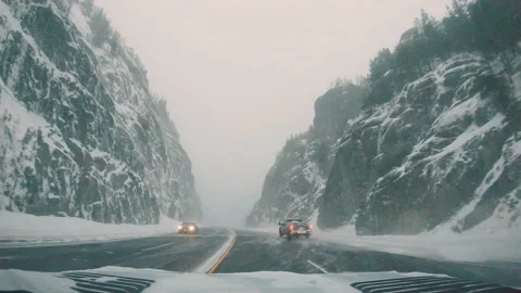 Driving in a winter storm in a canyon Stock Footage 169058434