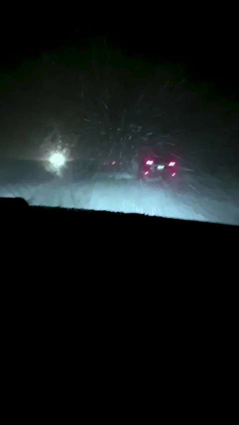 Driving in winter storm Stock Footage 221673066
