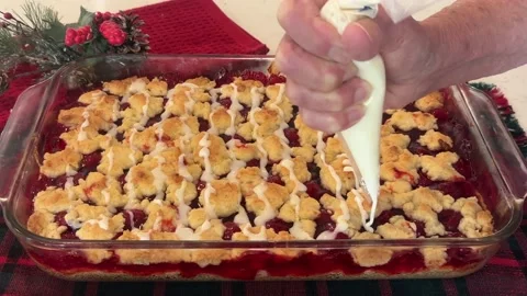 Drizzeling Icing On Cherry Pie Cookie Bars Stock Footage 222583120