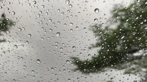 Drizzle Raindrops Falling and Sliding on Tilted Glass Surface Sky View Video stock 346161717