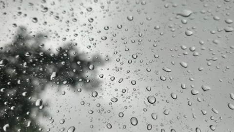 Drizzle Raindrops Falling and Sliding on Tilted Glass Surface Sky View Stock Footage 346161763