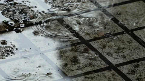 Drizzling rain dripped on the paved road. 4k videos. rainy season. Stock Footage 208656054