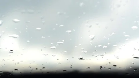 Drizzling rain drop on a window Stock Footage 74153900