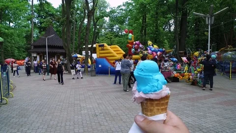 DROGOBYCH, UKRAINE - 3 MAY, 2019: Person without face holding blue ice cream in 스톡 동영상 108851920