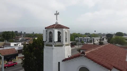 Dron arcs around cross on top of the church in Burbank Stock Footage 152548013