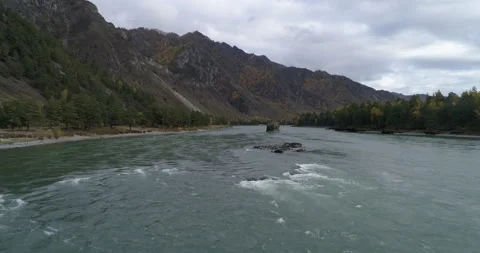 Dron flight above Katun scenic mountain river flowing along rocky terrain, Altai Stock Footage 143908015