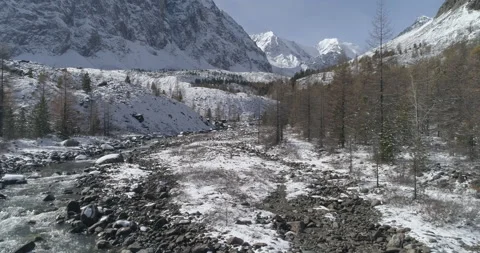 Dron flight over mountain stream in the area of ​​glacier near mountain Aktru Stock-Footage 143855953