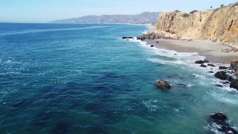 Dron flying above the Pacific ocean in Point Dume Malibu Stock Footage 274041775