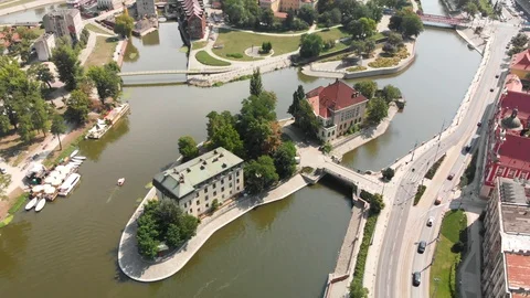 Dron is hovering over a river in the old city of Wroclaw. Stock Footage 94768364