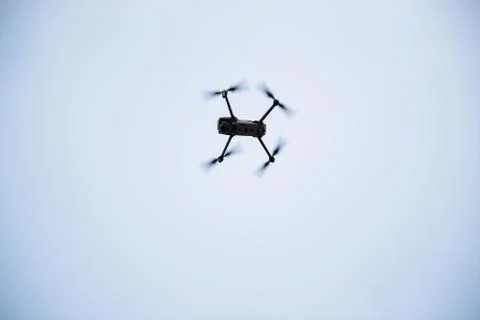 Dron overlooking the landscape in the background of a forest and village duri 写真素材
