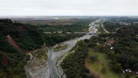 Dron shot above the river in front of the bridge in northern Argentina Stock Footage 220445071