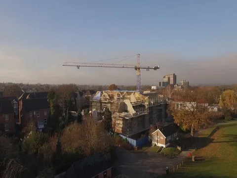 Drone 1080 Slowmotion approaching a construction site New build Stock Footage 82663469