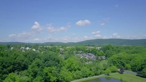 Drone 360 Degree Turn over Small Town Stock Footage 76806870